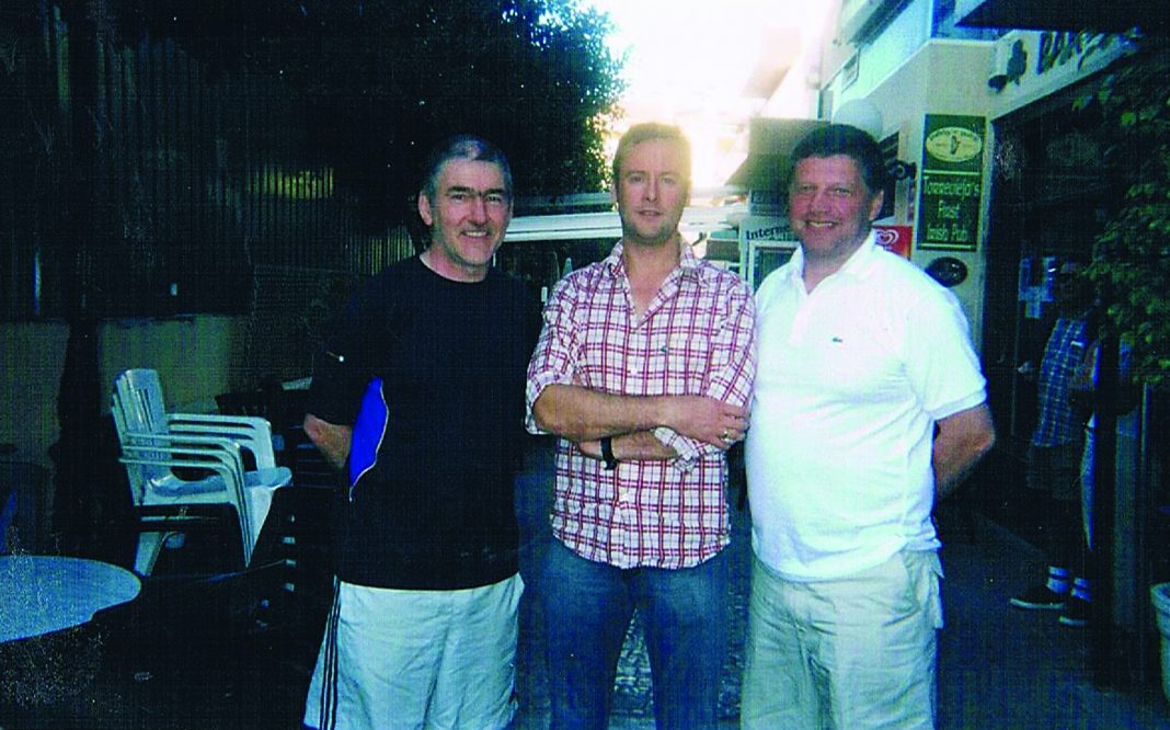 Son Ian pictured with legendary GAA football managers, Mickey Harte, (L) and John O'Mahony, (R) during a trip to La Zenia