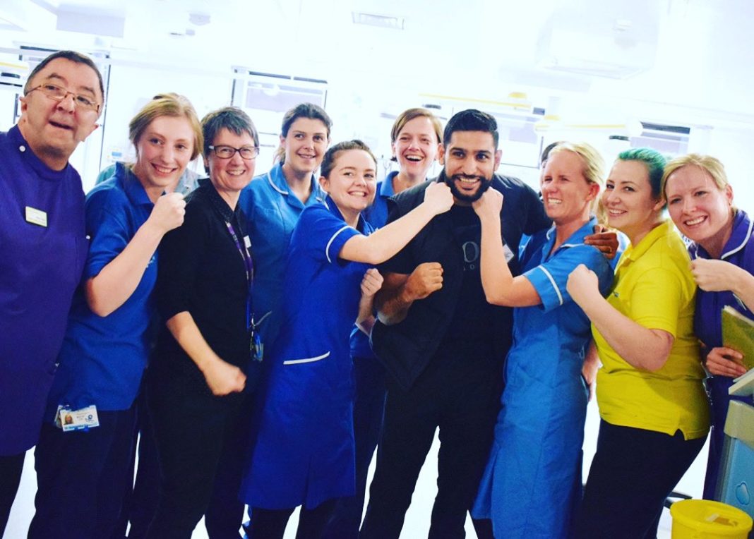 Amir Khan with NHS staff in his hometown of Bolton