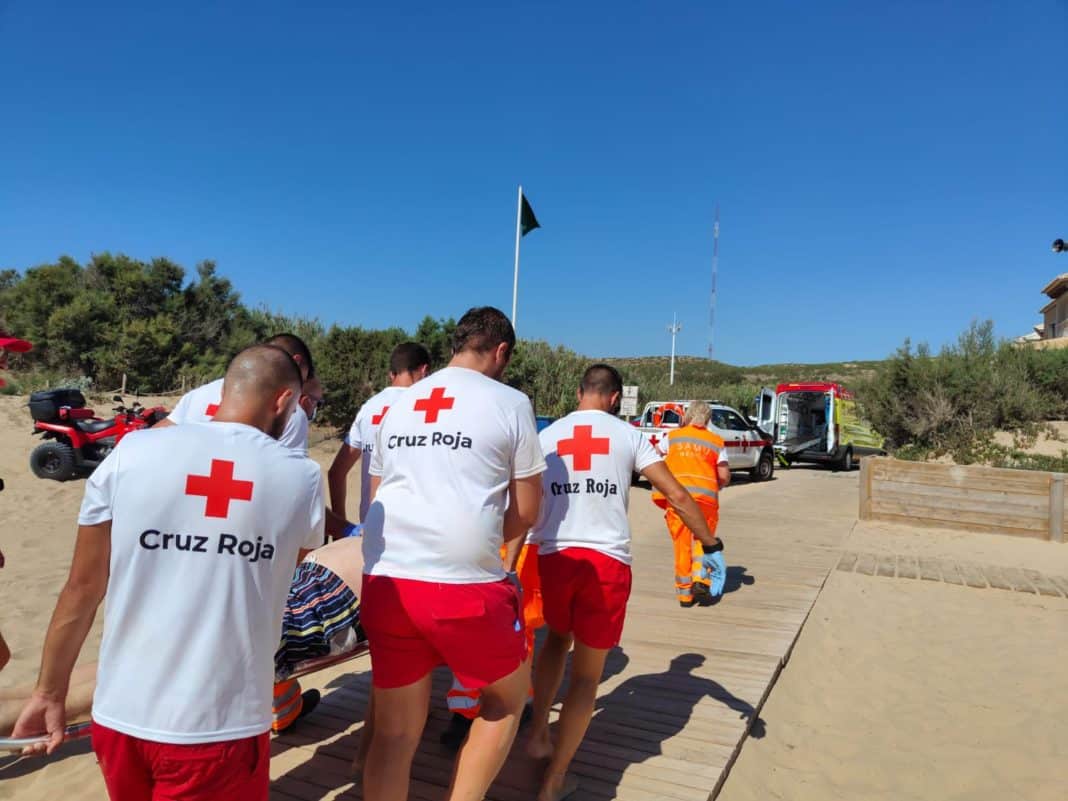 The bather is carried from the beach to a nearby ambulance. Image courtesy of Cruz Roja