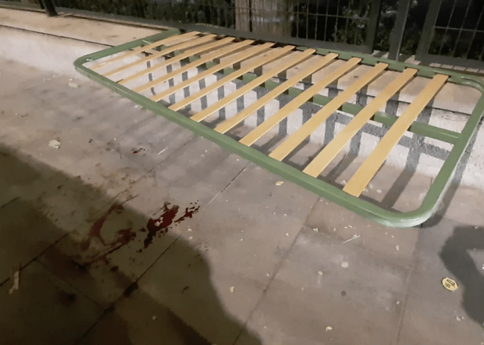 Pedestrian hospitalised after bed frame thrown from balcony