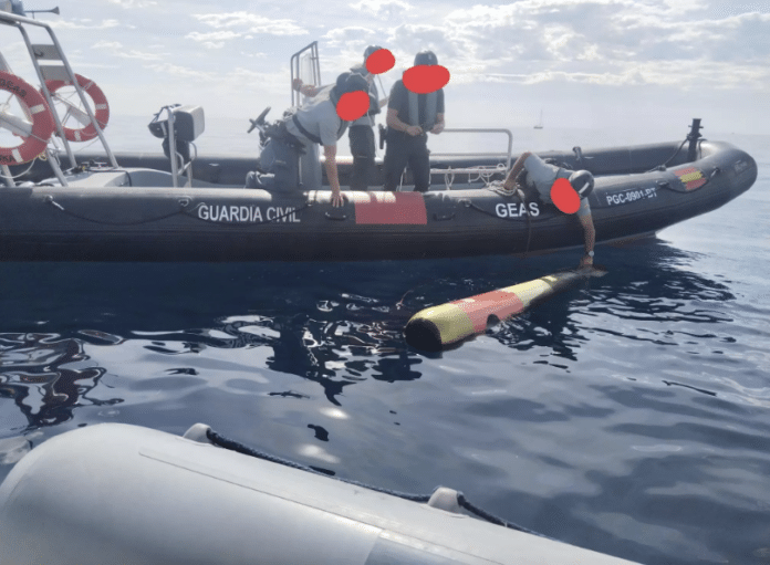 Guardia Civil officers inspect the rogue torpedo